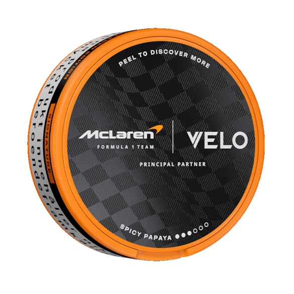 VELO McLaren Spicy Papaya 8mg — tropical papaya with aromatic spice warmth in the 2026 McLaren Circuit Collection. Strong, 11.4mg/g, 20 slim pouches. Limited edition. Tobacco-free. 21+.